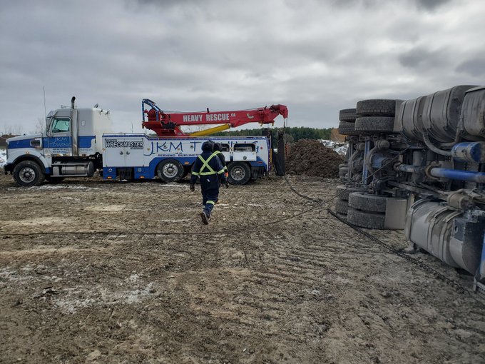 JKM crew recovering an overturned truck